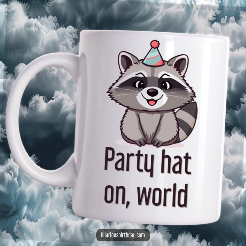 Funny raccoon mug shows a beaming raccoon with a wide smile wearing a ridiculously silly party hat.