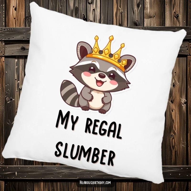 Funny pillow featuring a happy raccoon character triumphantly wearing a shiny golden crown, a cozy and humorous accent.