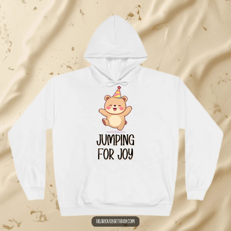 Funny kawaii bear in party hat, jumping with delight, cozy hoodie design, perfect funny gift for playful souls.