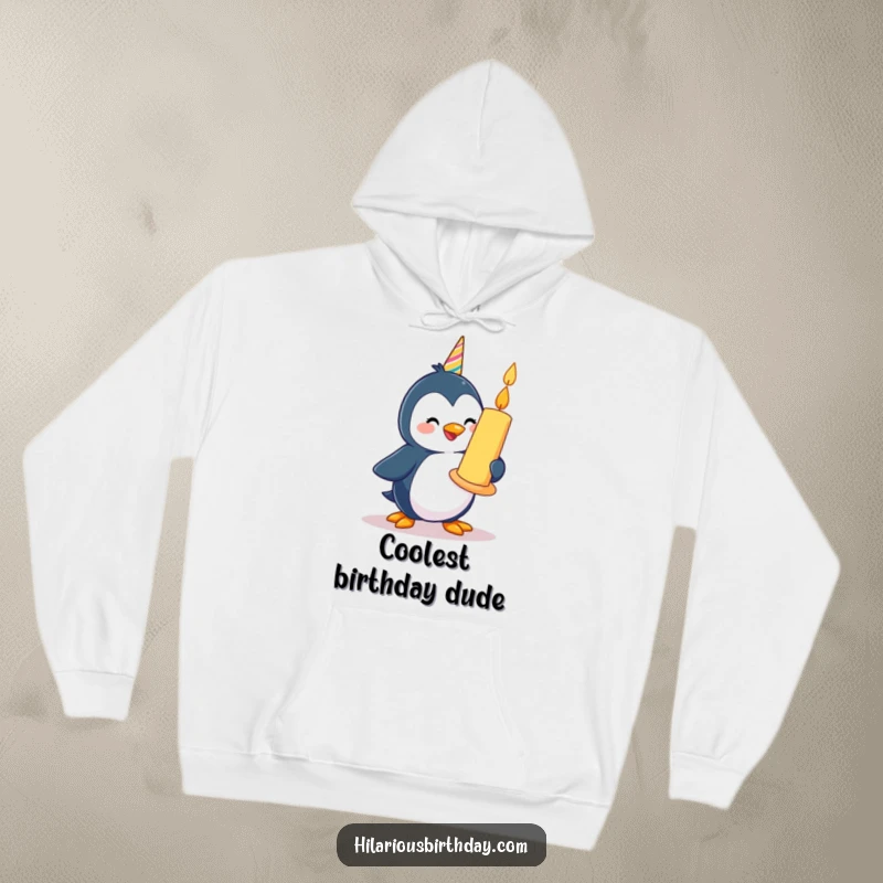 Funny happy penguin character waddling with a giant birthday candle, featured on a warm hoodie.