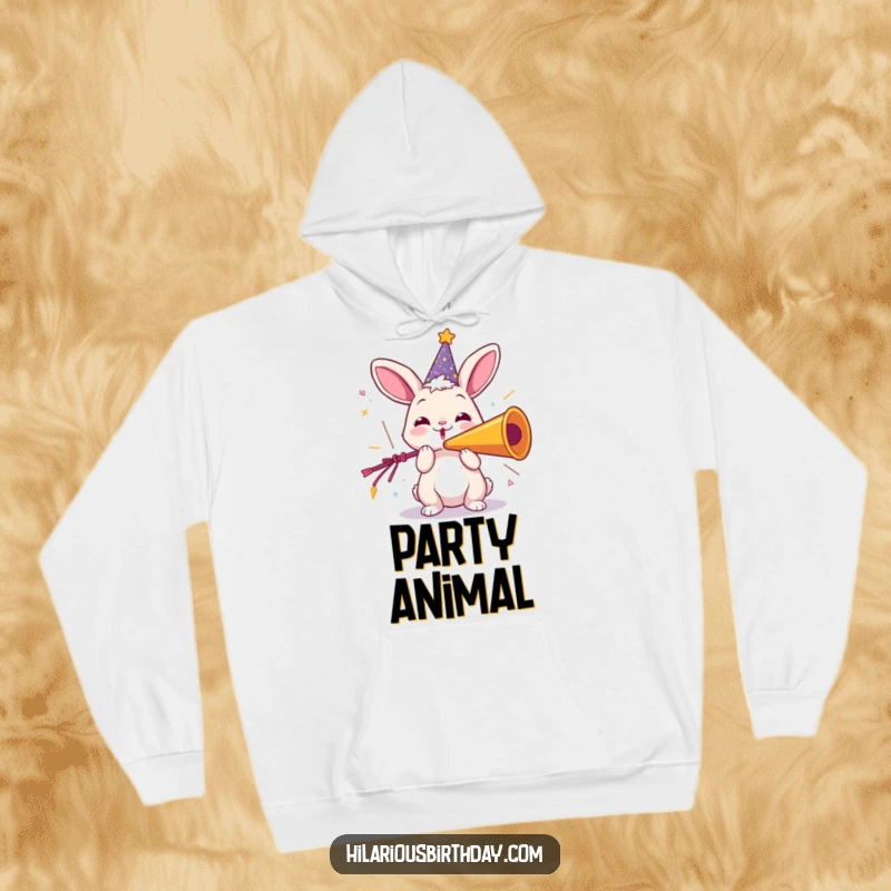 Funny hoodie depicting a playful rabbit in a sparkly party hat, joyfully blowing a giant party horn, perfect for warm, festive comfort.
