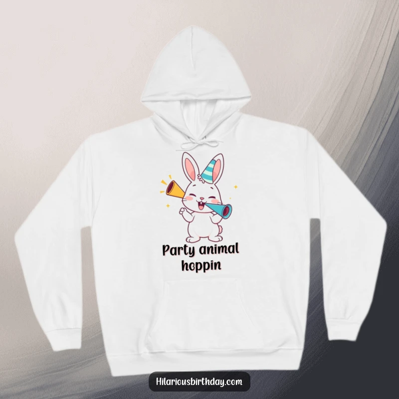 Funny bunny hoodie, a happy bunny character blowing enthusiastically on a party horn, cozy festive wear.