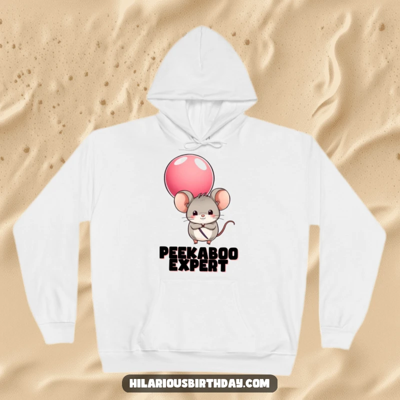 Funny hoodie featuring a round mouse character hiding behind a colorful balloon, offering comfort and a touch of playful charm.
