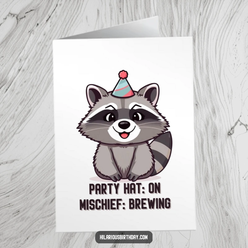 Funny Free Printable Birthday Card features a beaming raccoon sporting a comically oversized and silly party hat, ready for festivities.