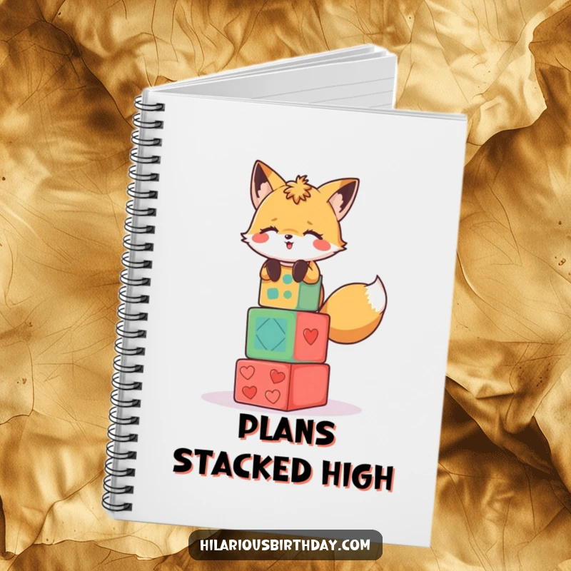 Funny notebook cover featuring a giggling fox character stacking colorful party blocks.