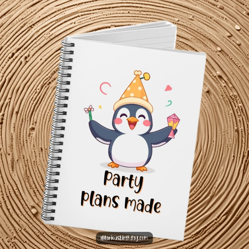 Funny notebook with a happy penguin wearing a festive hat, perfect for jotting down party ideas or festive plans.