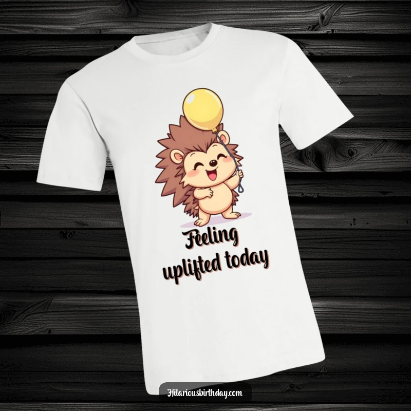 Funny smiling hedgehog character excitedly grasping a floating balloon on this humorous t-shirt, radiating pure joy, a great funny gift.