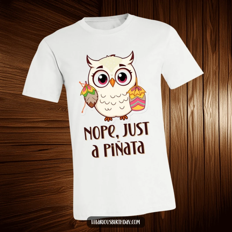 Funny Kawaii Owl T-Shirt: A startled, wide-eyed owl character is hilariously mesmerized by a dangling piñata, perfect for gifting.