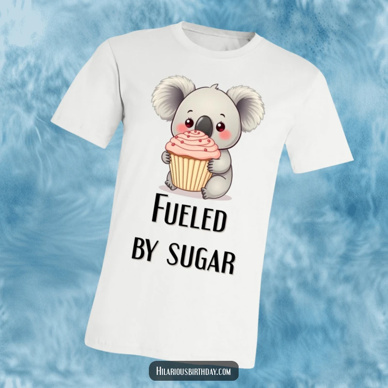 Funny koala holding a huge, frosting-covered cupcake on this t-shirt, a delightful and humorous treat.