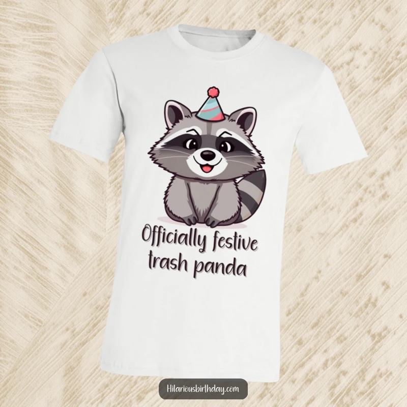 Funny raccoon t-shirt depicting a beaming raccoon with a huge grin, sporting a comically large and silly party hat.