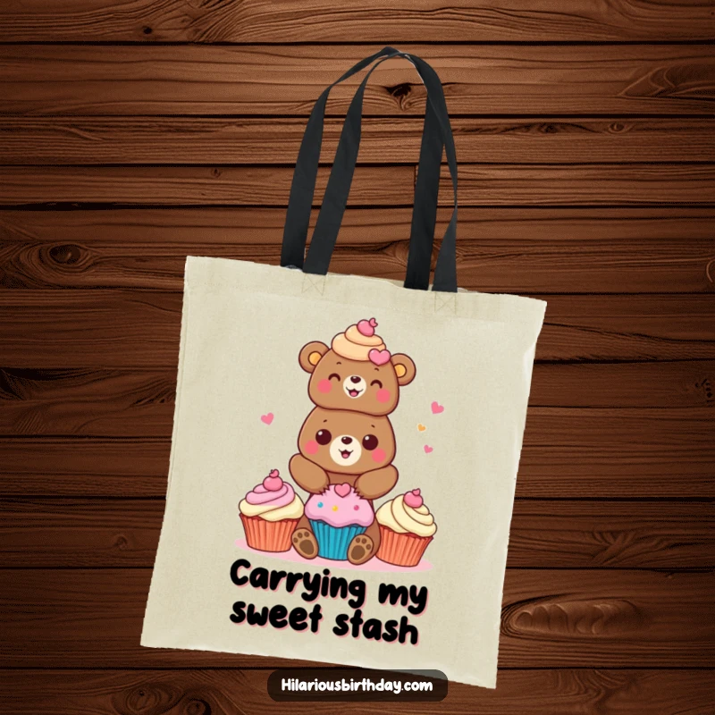 Funny bear tote bag with a cheerful bear character stacking brightly colored cupcakes, perfect for carrying treats.