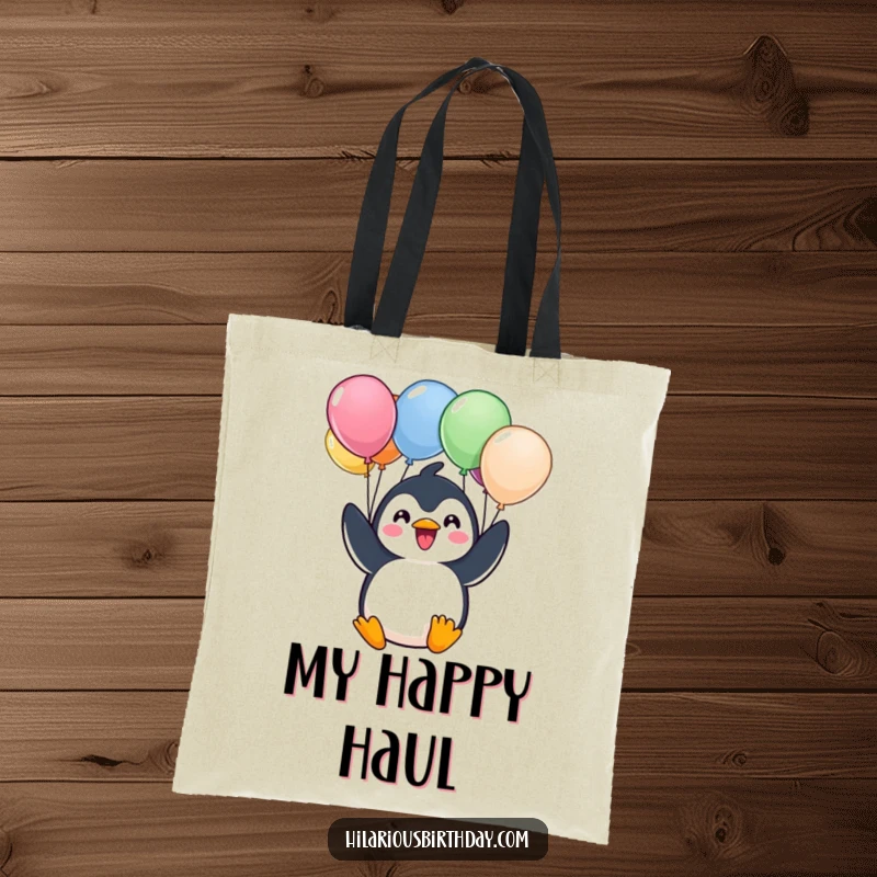 Funny tote bag featuring a cheerful Kawaii penguin character excitedly holding a bunch of colorful balloons, a delightful carry-all.