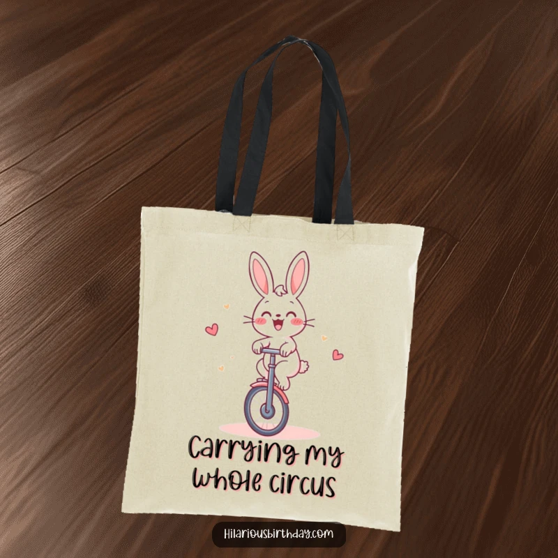 Funny Rabbit Tote Bag: Cheerful rabbit gleefully riding a unicycle around a cake, great for shopping humor.