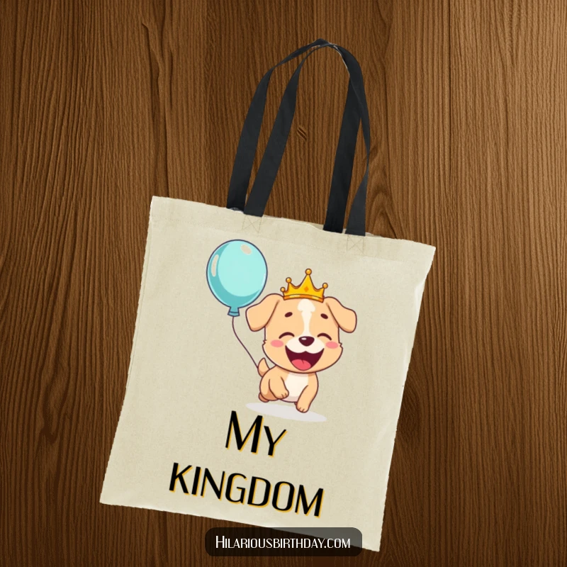 Funny tote bag featuring a giggling dog wearing a crown, gleefully chasing a floating balloon, great for daily errands.